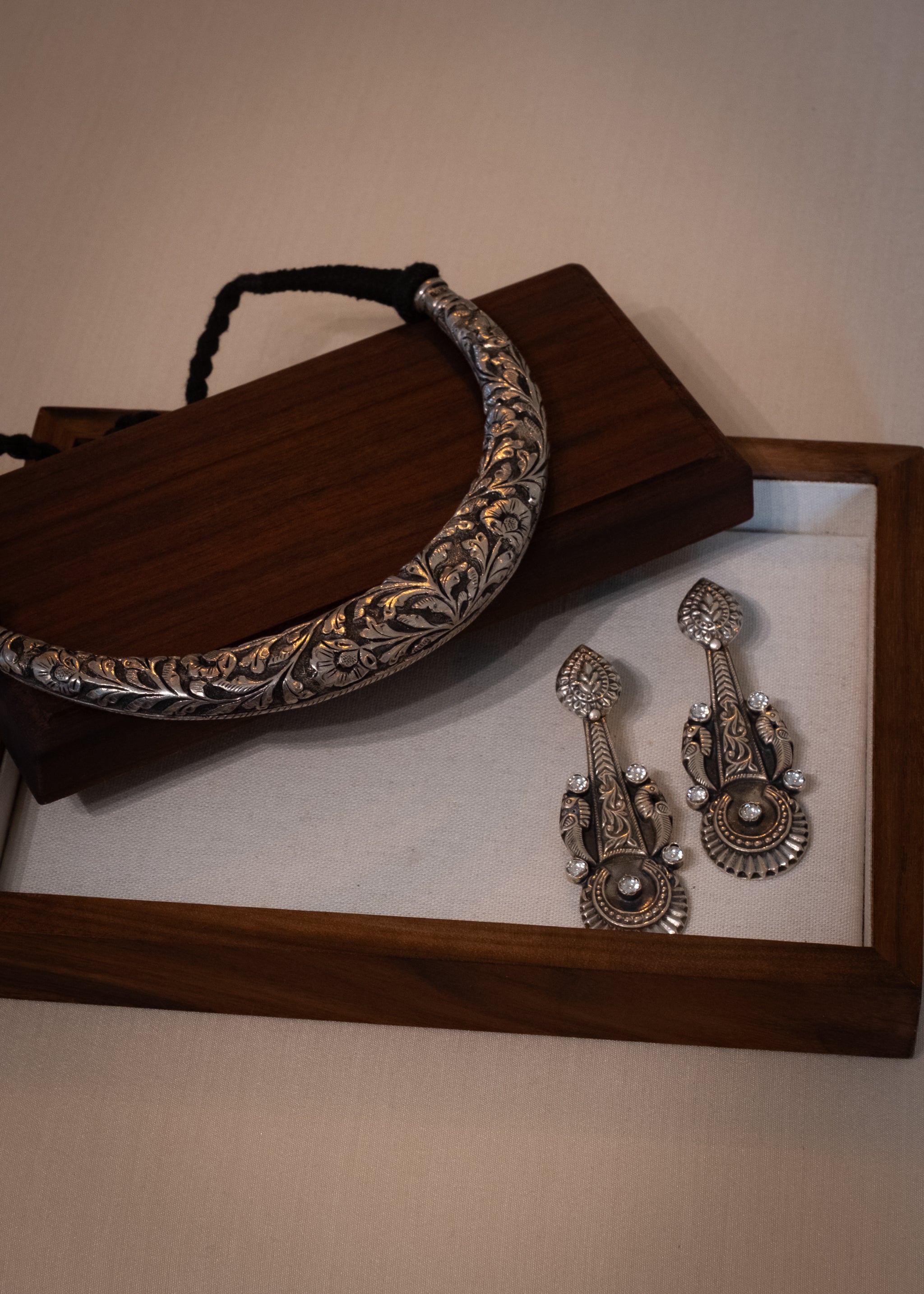 Shuka Earrings - handcrafted sterling silver parrot motif earrings - styled view by The Loving Good